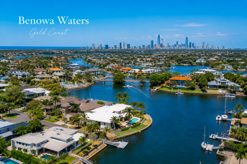 Scenic waterfront homes with city skyline