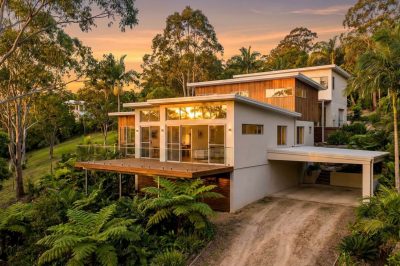 Split level home design built into a sloping Gold Coast hinterland block with timber deck and stepped levels