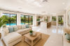 Open-plan custom home with designer kitchen by Bluewood Homes Gold Coast